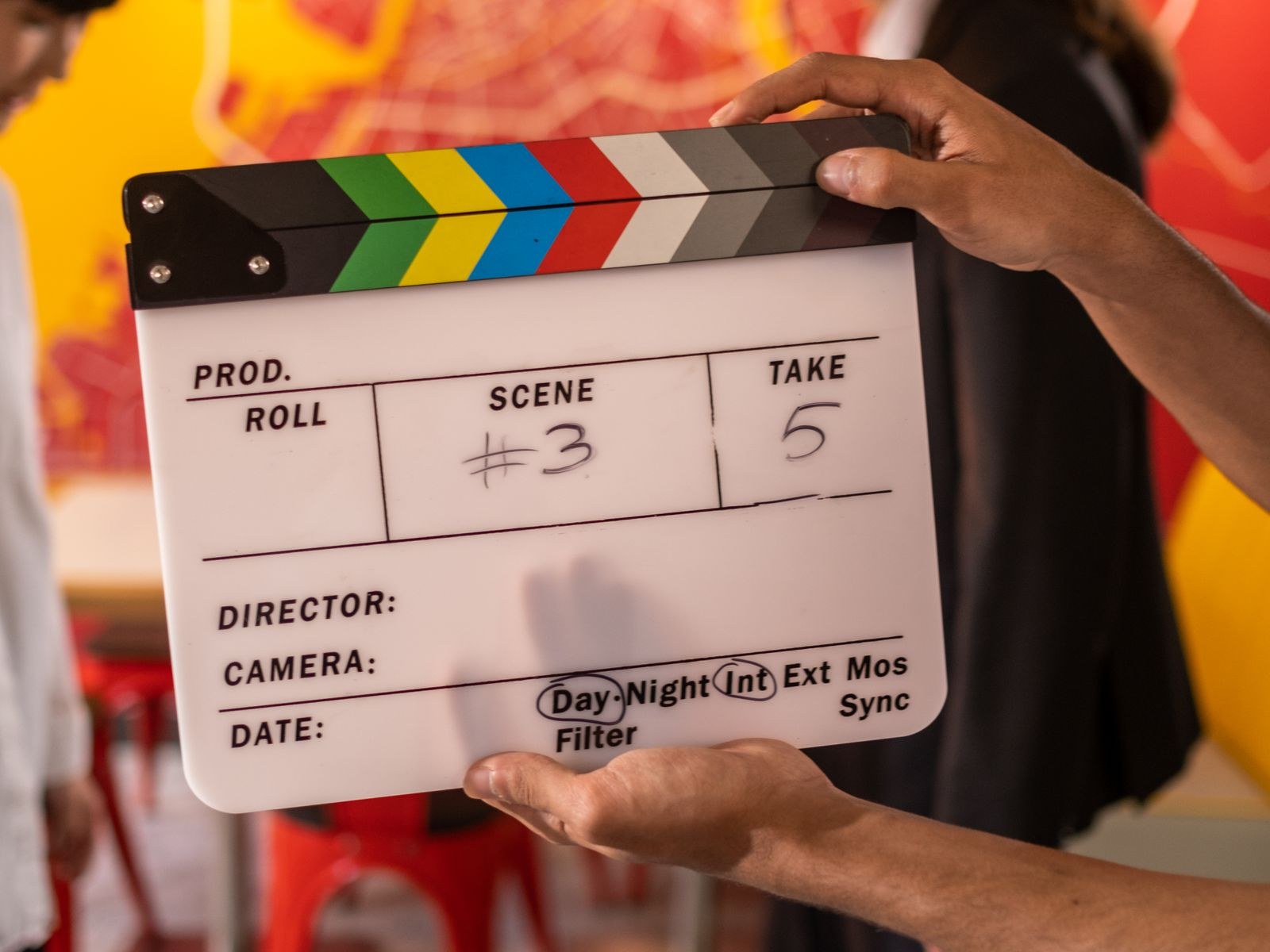 Camera and clapperboard on a film set